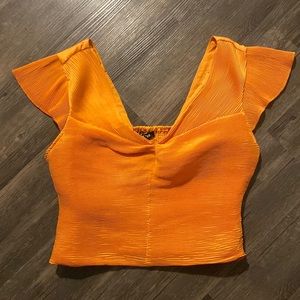 NWT Express size L bright orange smocked-back blouse with flutter sleeves